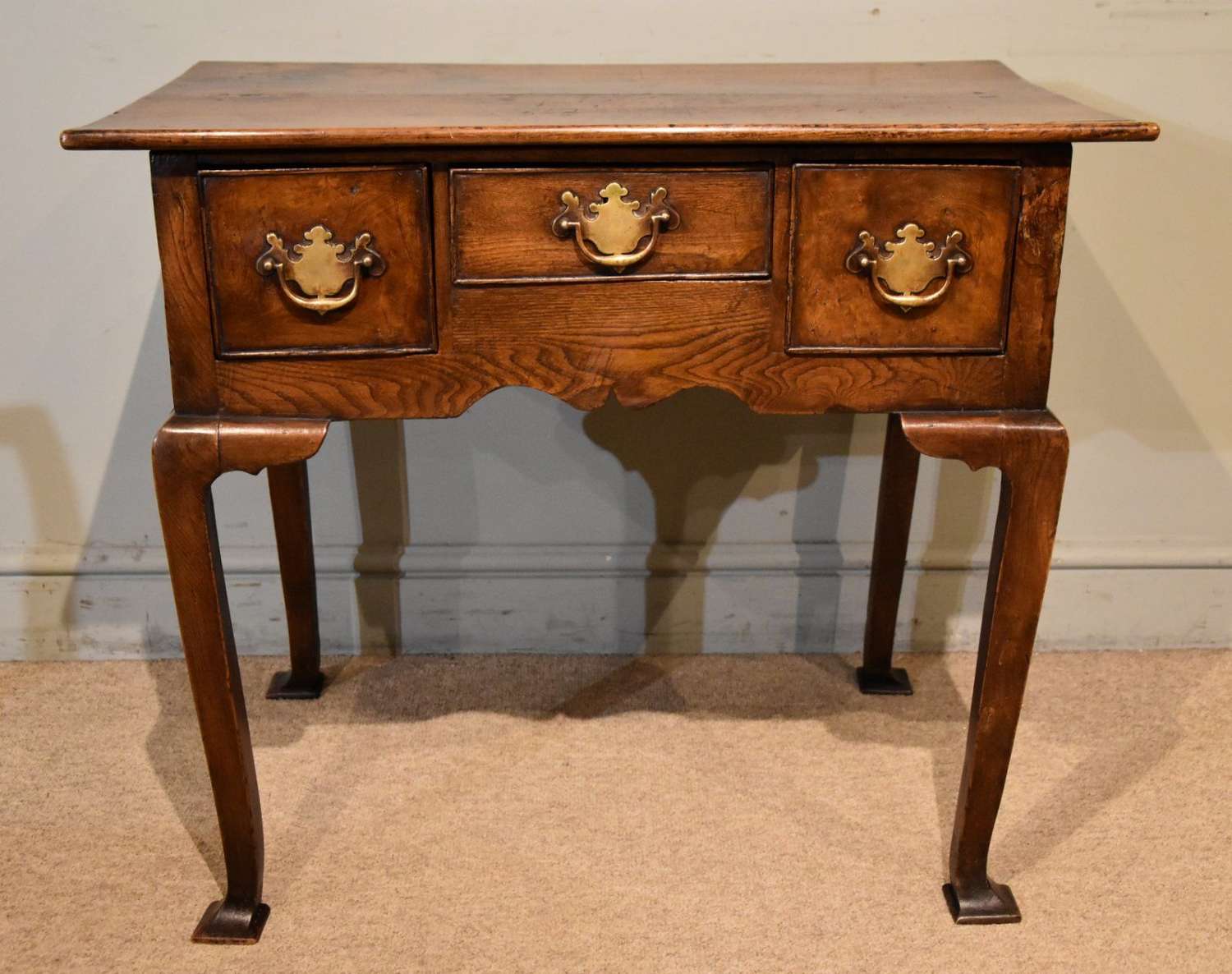 18th Century elm lowboy with three drawers