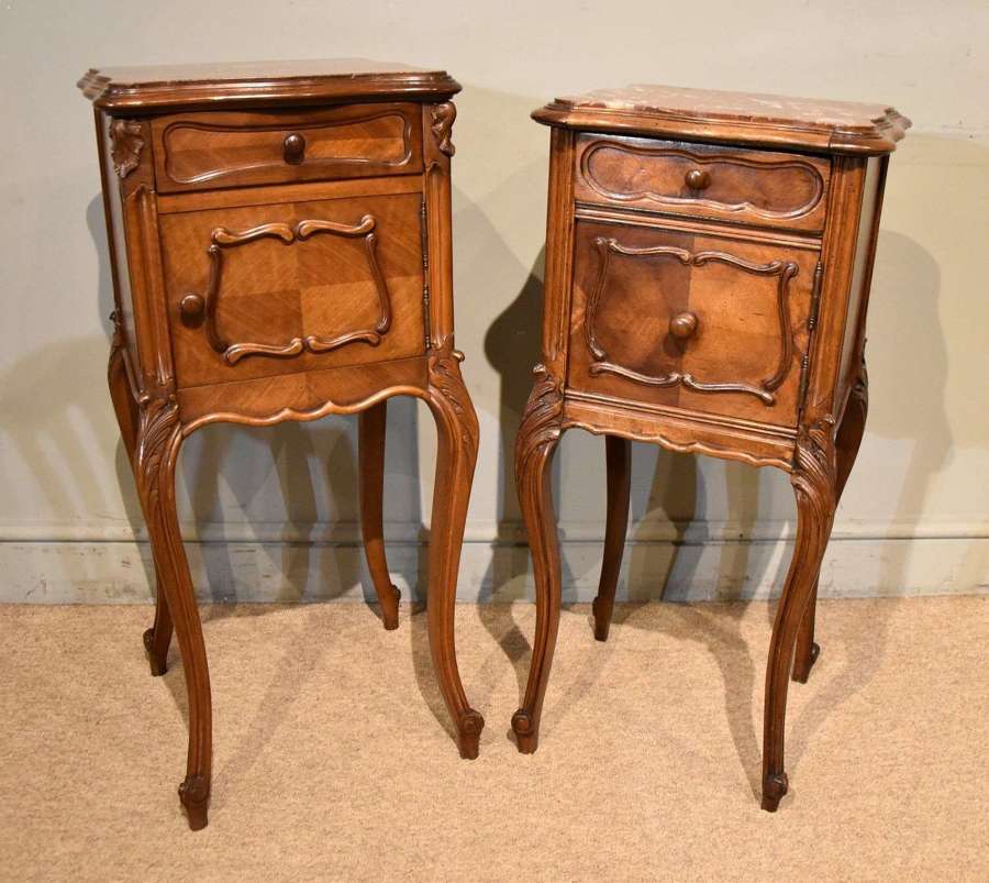 Two French walnut bedside cupboards with marble tops