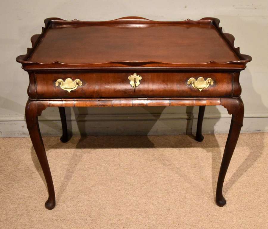 George II mahogany silver table raised on cabriole legs