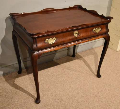 George II mahogany silver table raised on cabriole legs