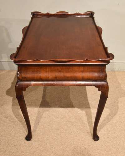 George II mahogany silver table raised on cabriole legs