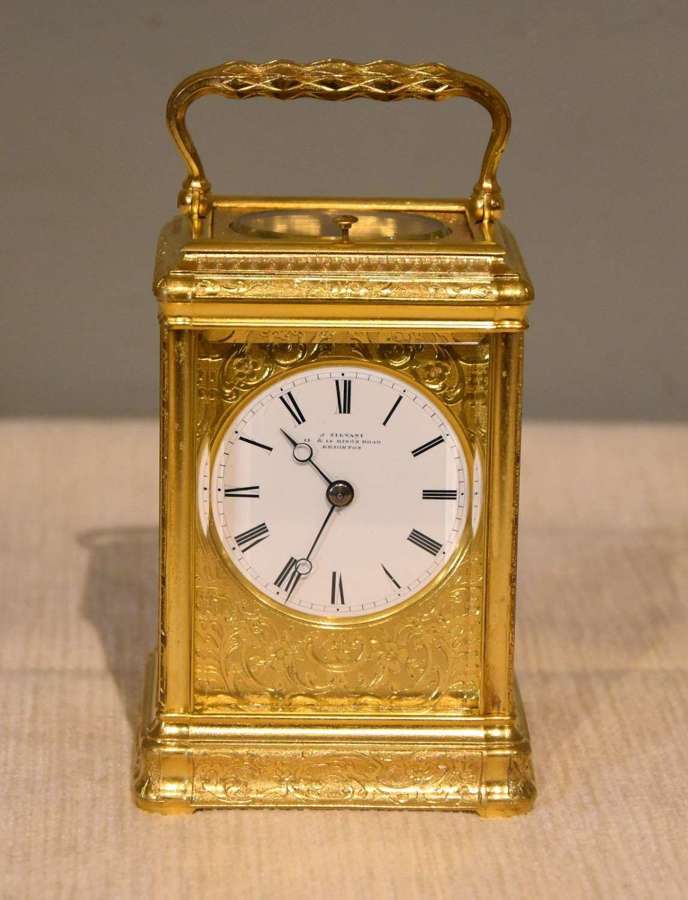 An engraved gorge cased carriage clock