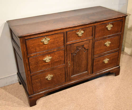 Small mid 18th century oak dresser base