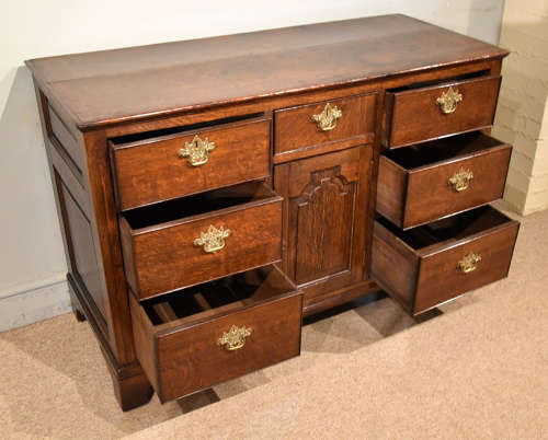 Small mid 18th century oak dresser base