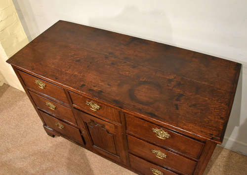 Small mid 18th century oak dresser base