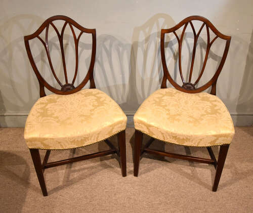 Pair of George III mahogany shield back chairs