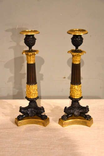 Pair of French empire bronze and gilt bronze candlesticks