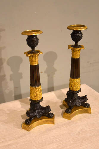 Pair of French empire bronze and gilt bronze candlesticks