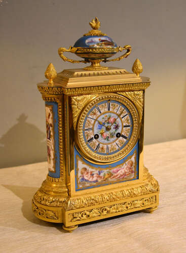 J.B Delettrez: A Porcelain and ormolu mantel clock