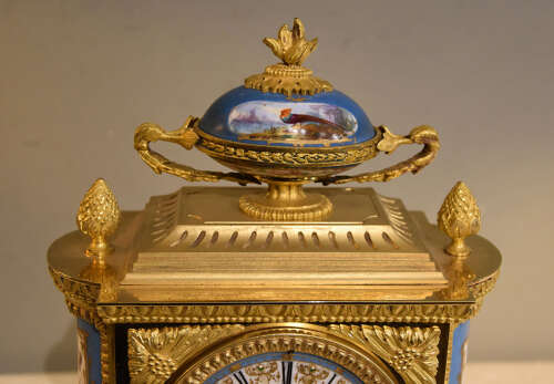 J.B Delettrez: A Porcelain and ormolu mantel clock