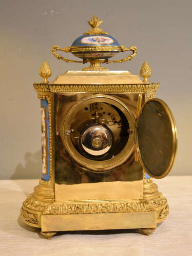 J.B Delettrez: A Porcelain and ormolu mantel clock