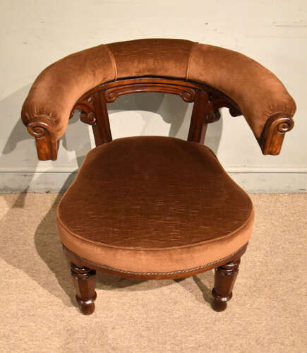 Mid 19th century walnut library armchair