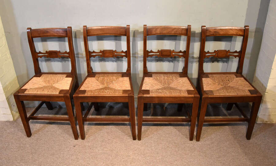 Set of four early 19th century fruitwood dining chairs
