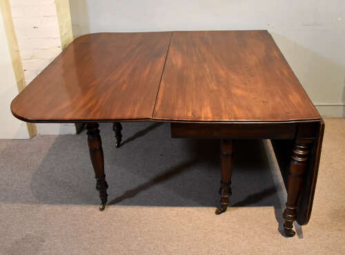Regency period large drop leaf mahogany dining table