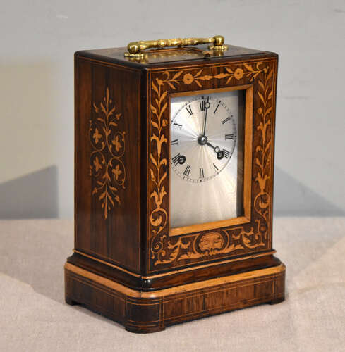 A French inlaid rosewood mantel clock