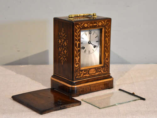 A French inlaid rosewood mantel clock