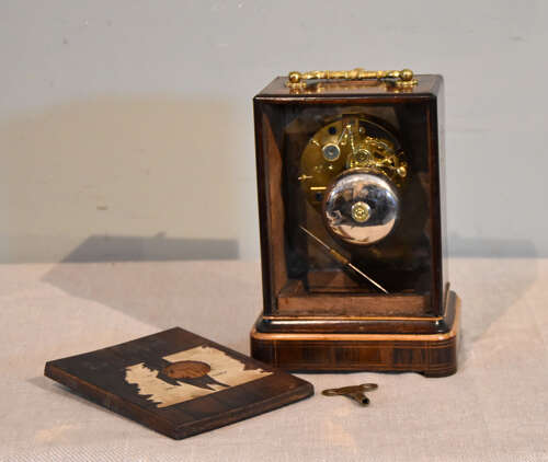 A French inlaid rosewood mantel clock